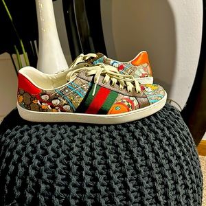 Gucci sneaker with Disney characters over entire sneaker